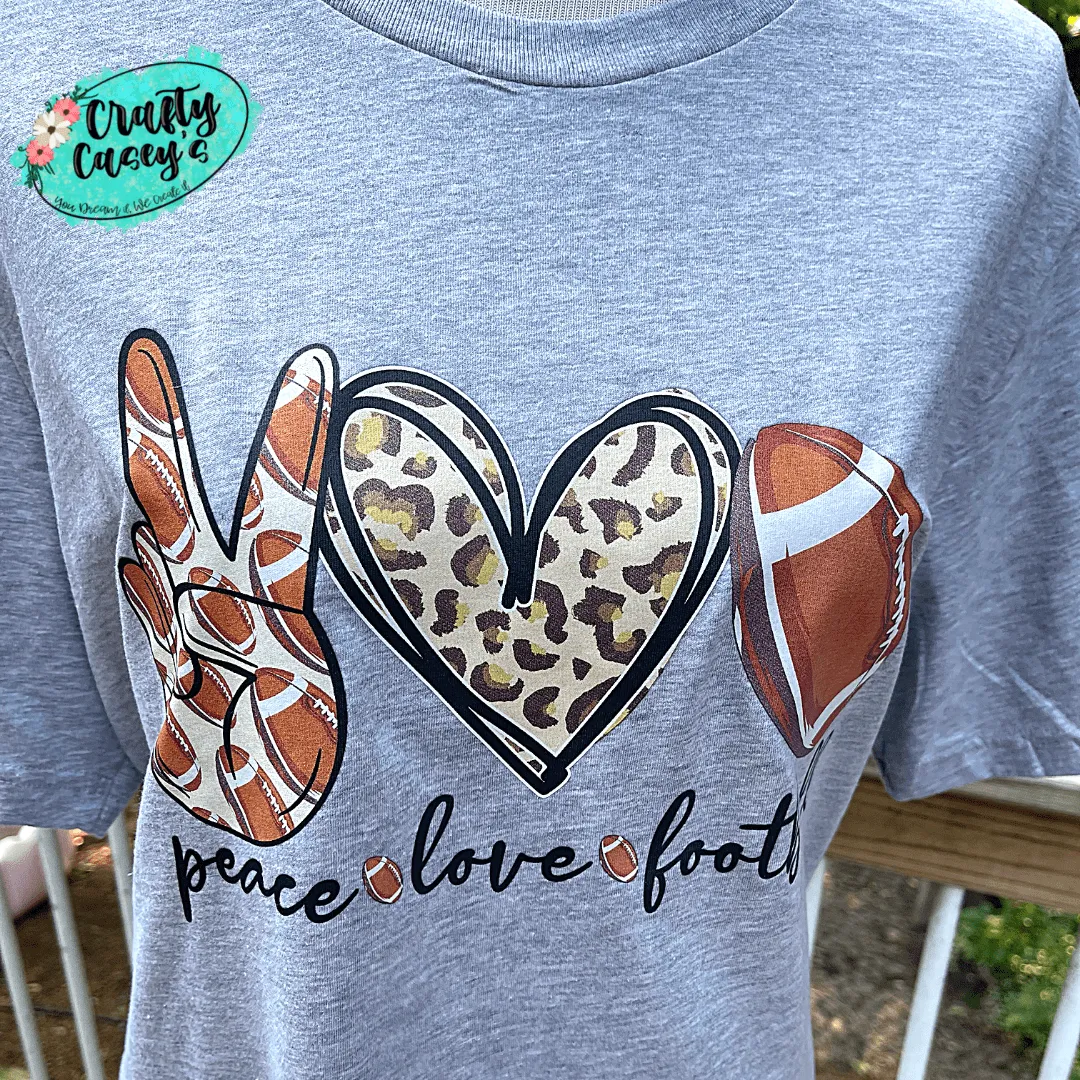 Peace Love Leopard Football T-shirt.